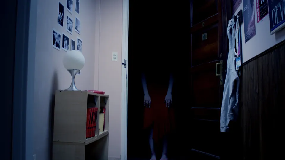 Live-action hallway with a figure in the doorway