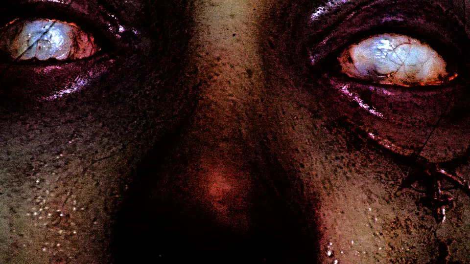 Bloodshot monstrous eyes staring from the dark