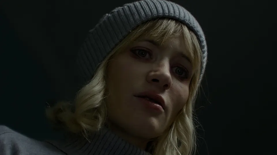 Live-action close-up of the heroine in a beanie